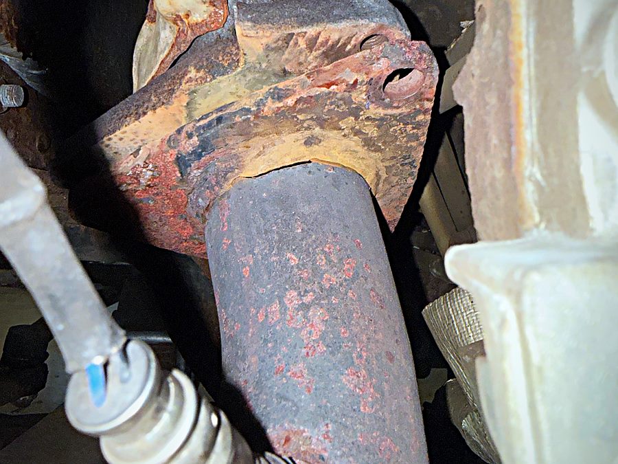 Exhaust pipe and oxygen sensor under a vehicle